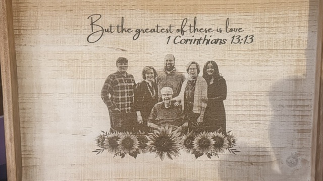 Engraved wooden keepsake box with a family portrait, sunflowers and the verse “But the greatest of these is love — 1 Corinthians 13:13”